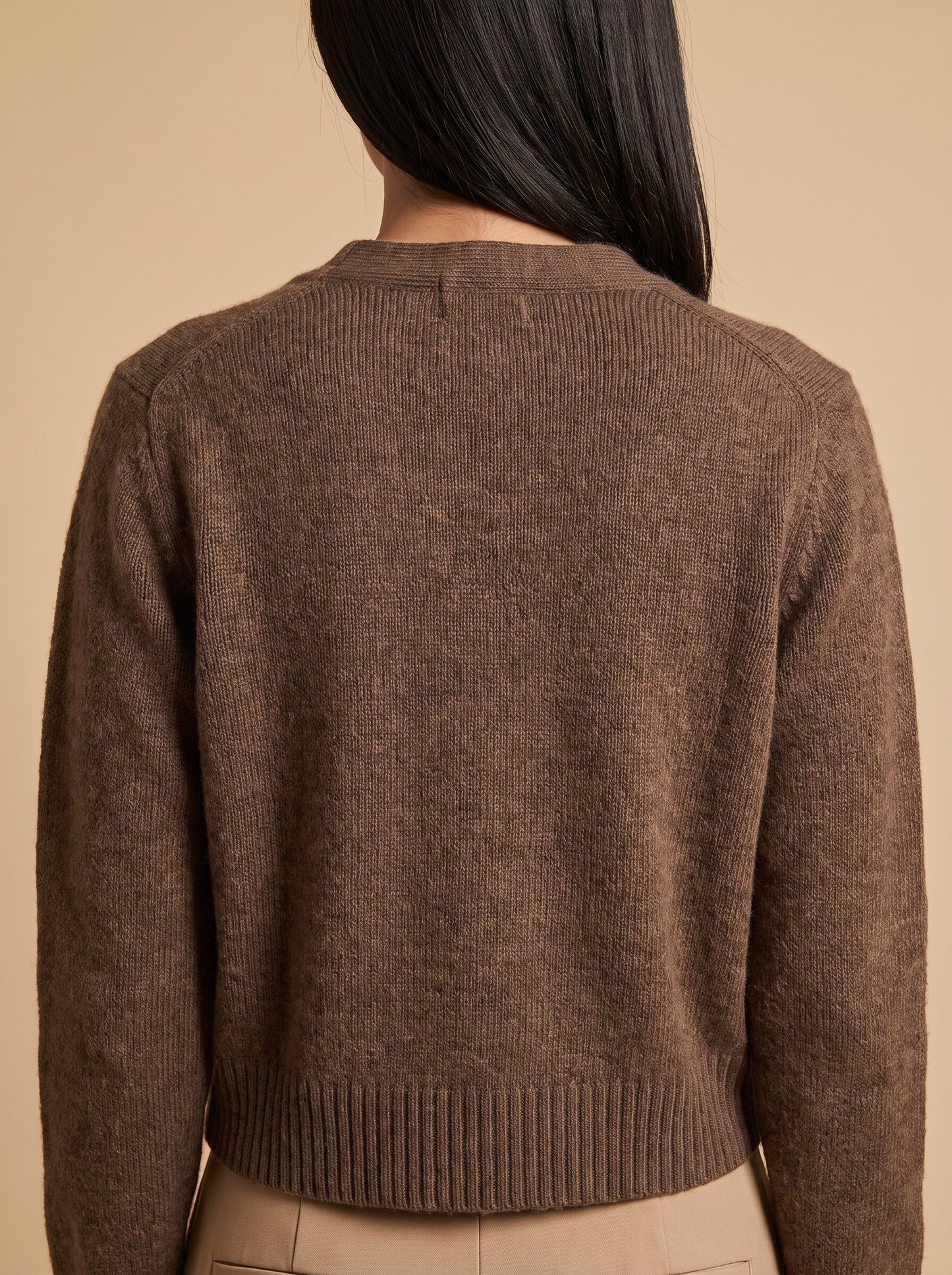 Women's cropped button up cardigan in brown, back view
