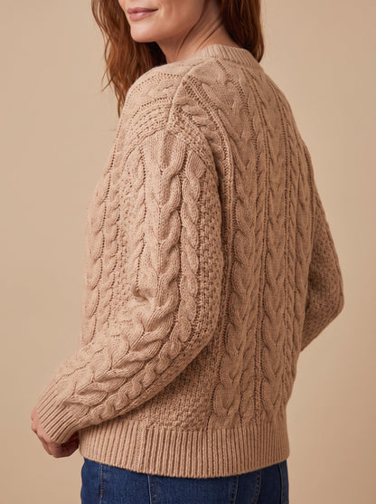 Women's chunky cable knit cardigan in beige, side view