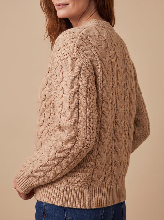 Women's chunky cable knit cardigan in beige, side view